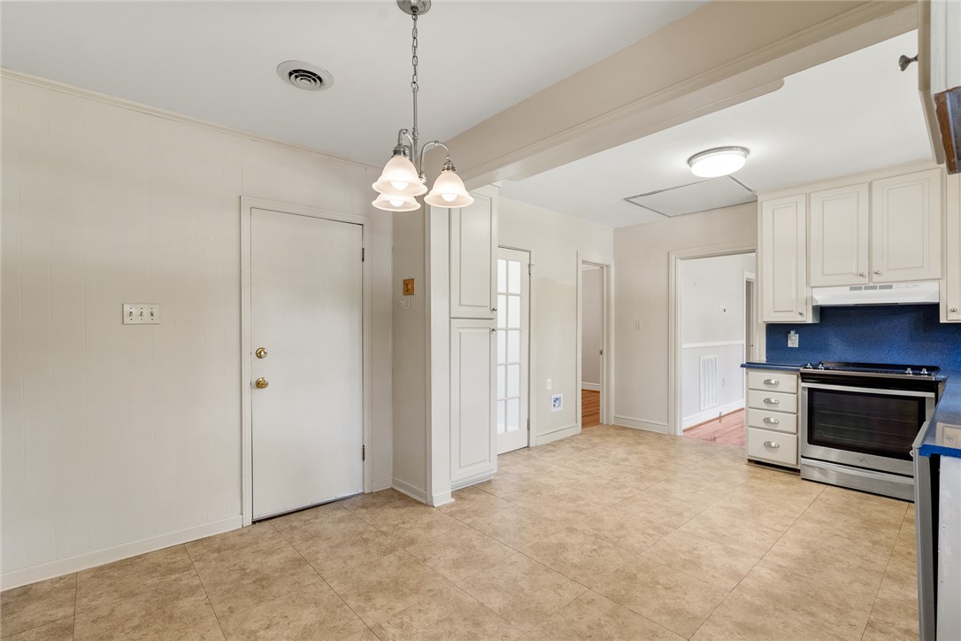 1509 869 Anderson, SC 29621 - Photo 20 of 45 A well-lit kitchen space featuring tile flooring and functional cabinetry for ample storage.