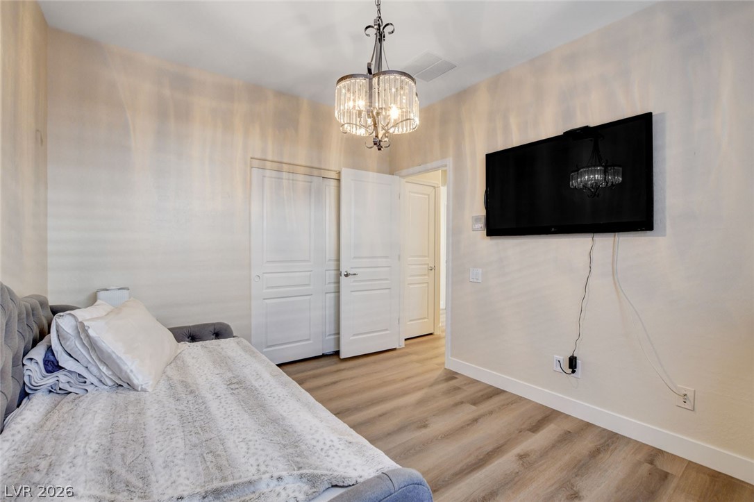2649 Rue Marquette Avenue Henderson, NV 89044 - Photo 38 of 55 This naturally illuminated bedroom offers versatile space with durable flooring and stylish lighting.