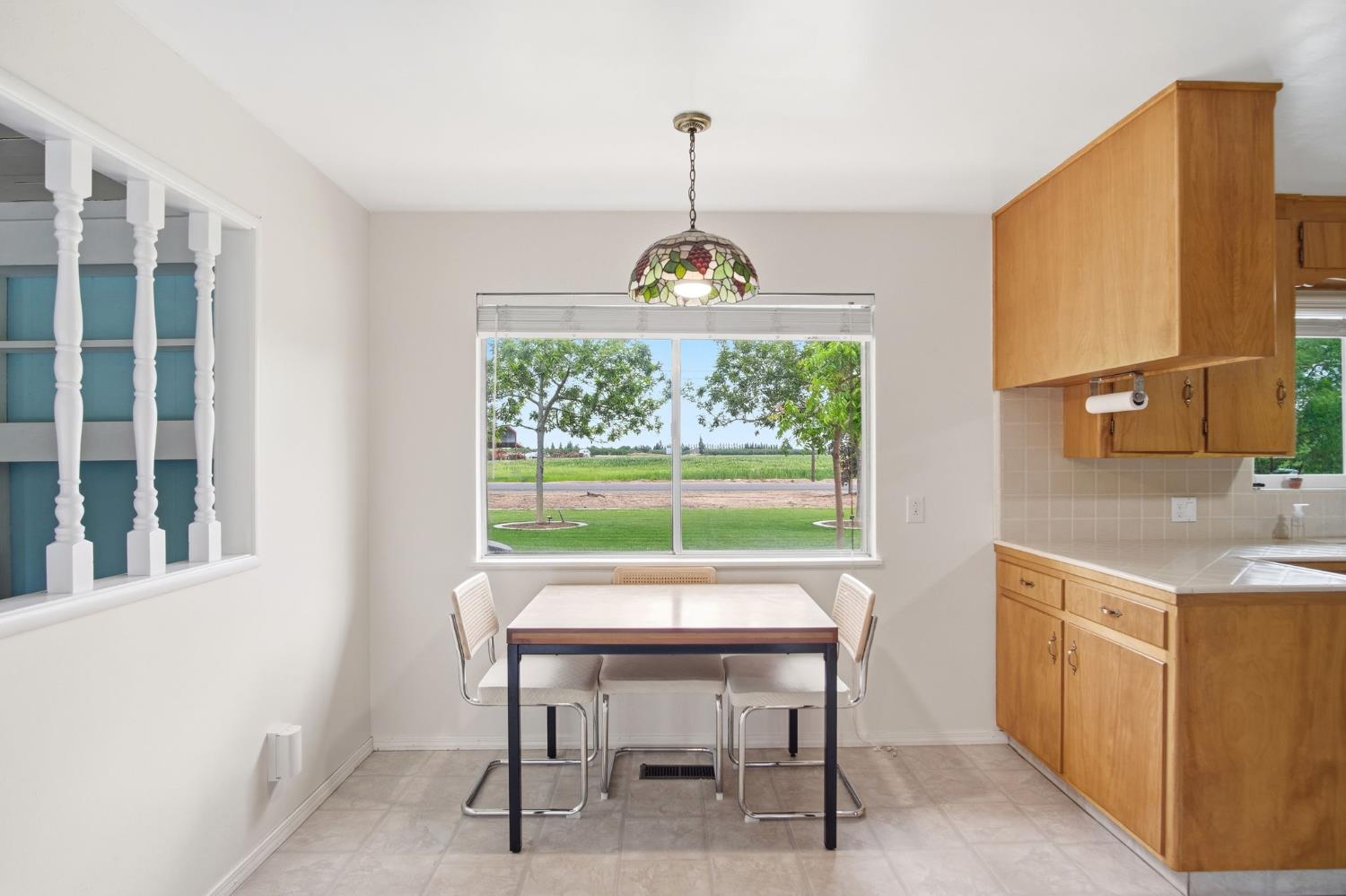 3501 North Avenue Modesto, CA 95358 - Photo 11 of 44 a table and chairs in a room