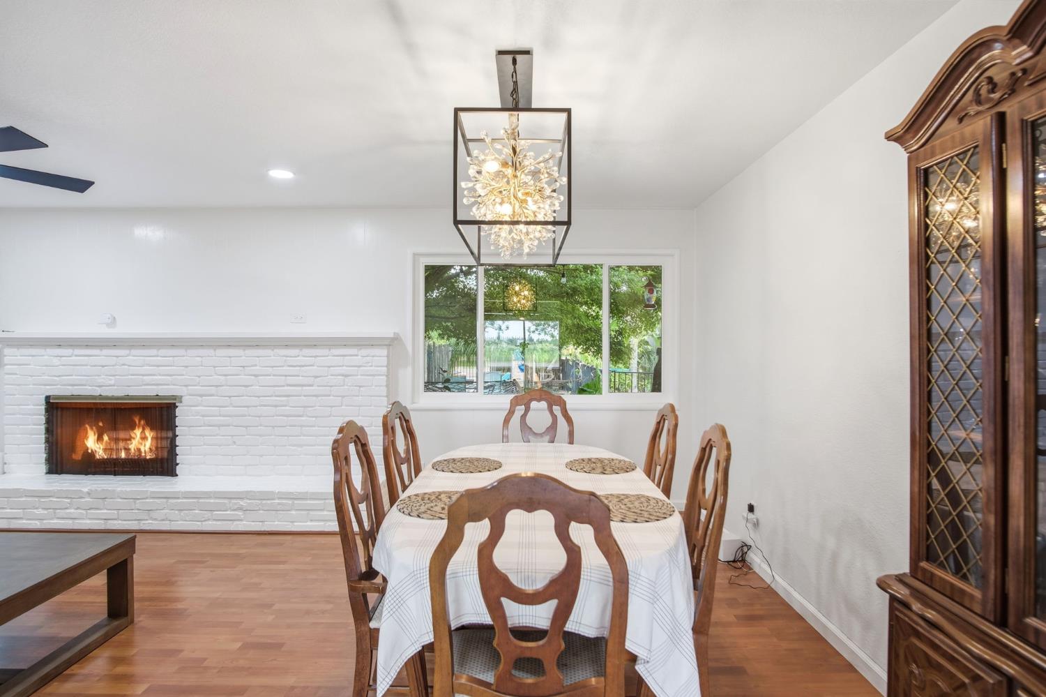 3501 North Avenue Modesto, CA 95358 - Photo 14 of 44 a view of a dining room with furniture and wooden floor