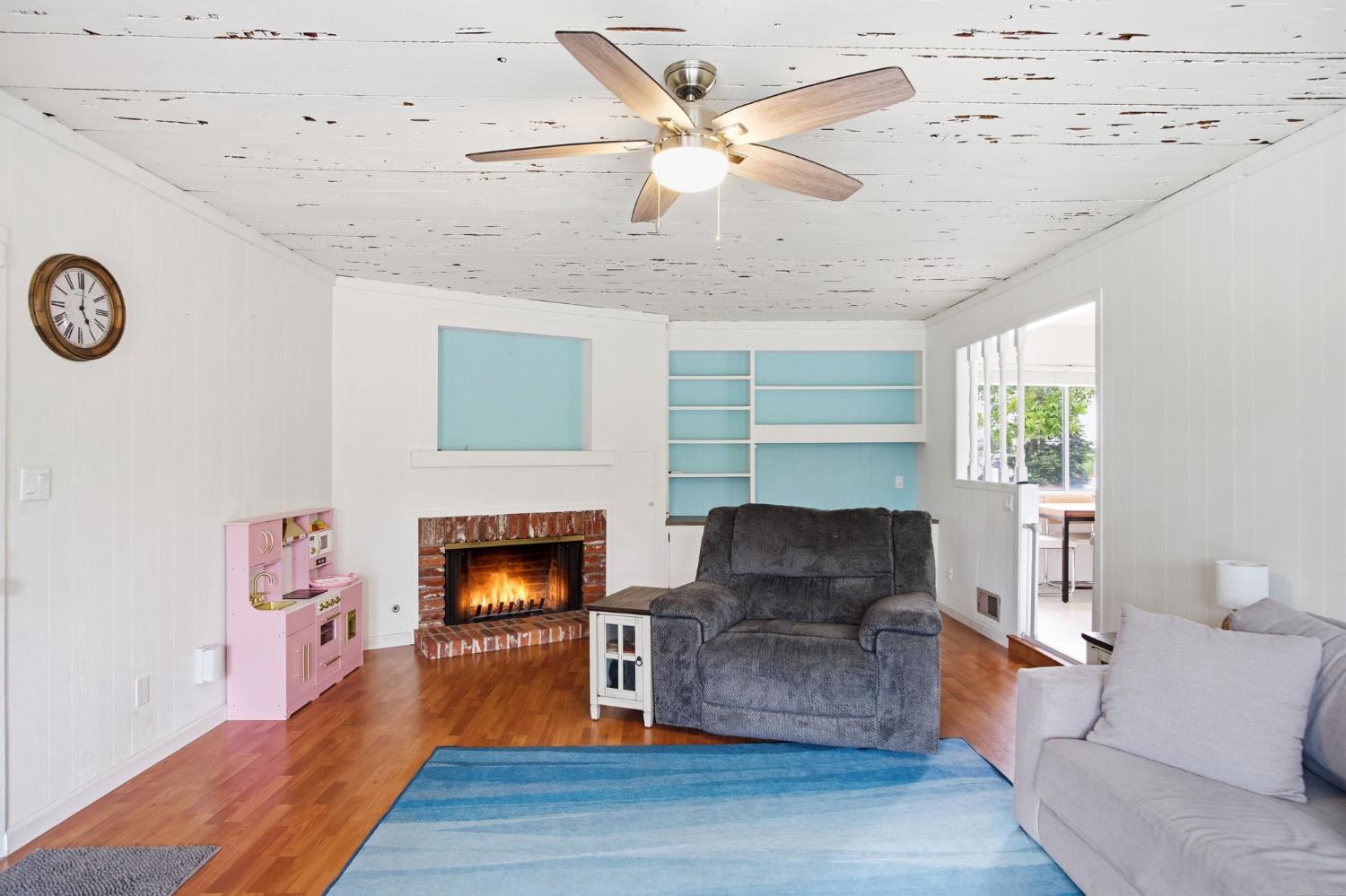 3501 North Avenue Modesto, CA 95358 - Photo 18 of 44 a living room with furniture and a fireplace