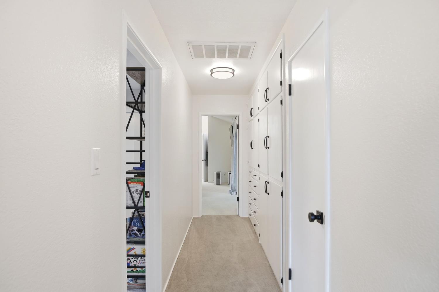 3501 North Avenue Modesto, CA 95358 - Photo 20 of 44 a view of a hallway with wooden floor and entryway