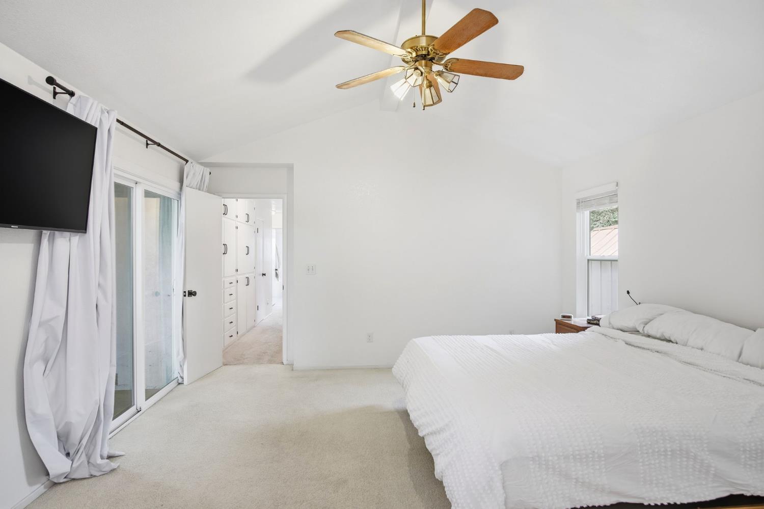 3501 North Avenue Modesto, CA 95358 - Photo 23 of 44 a bedroom with a bed and a chandelier