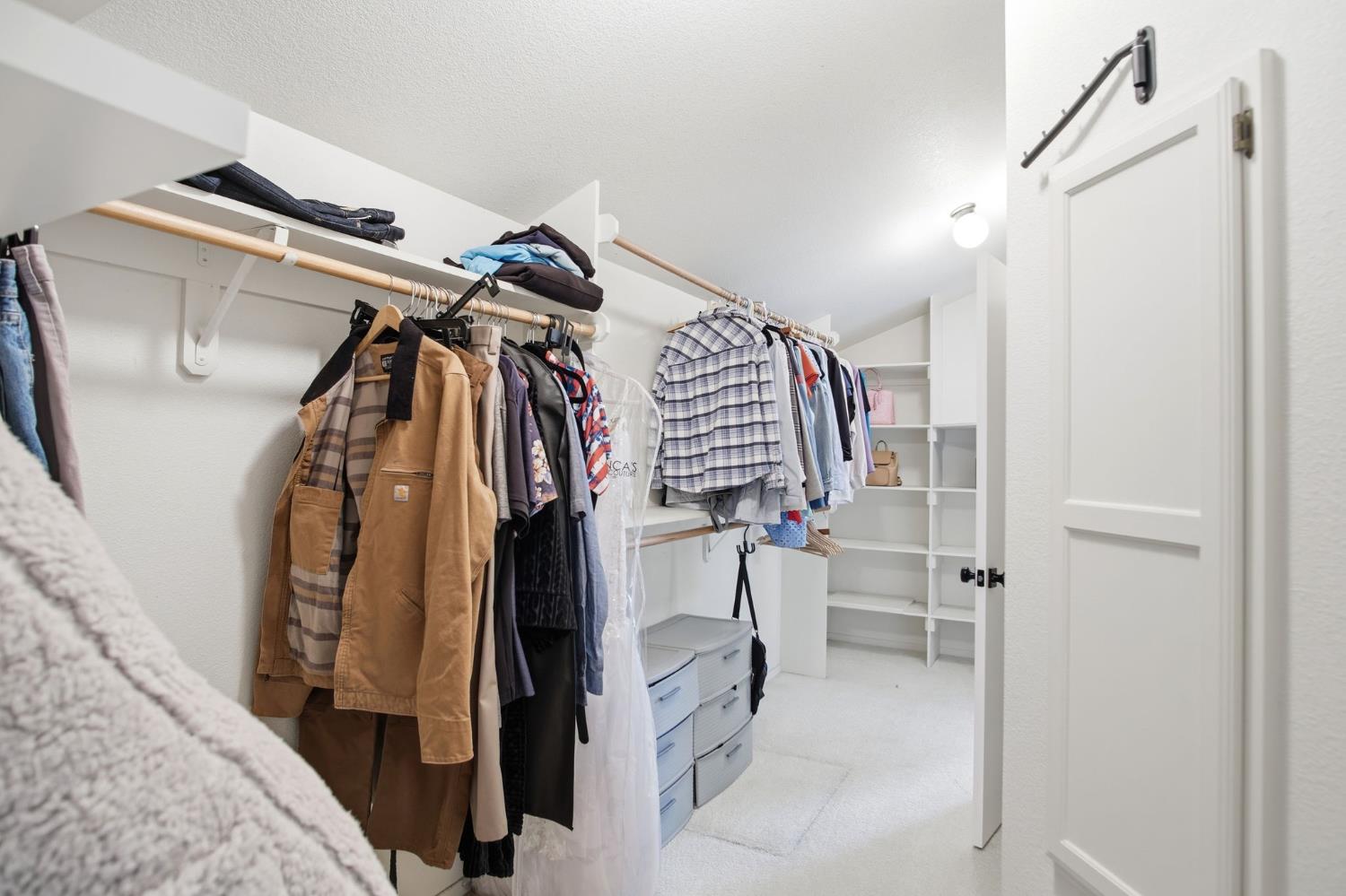 3501 North Avenue Modesto, CA 95358 - Photo 24 of 44 a view of walk in closet with clothes and shoes