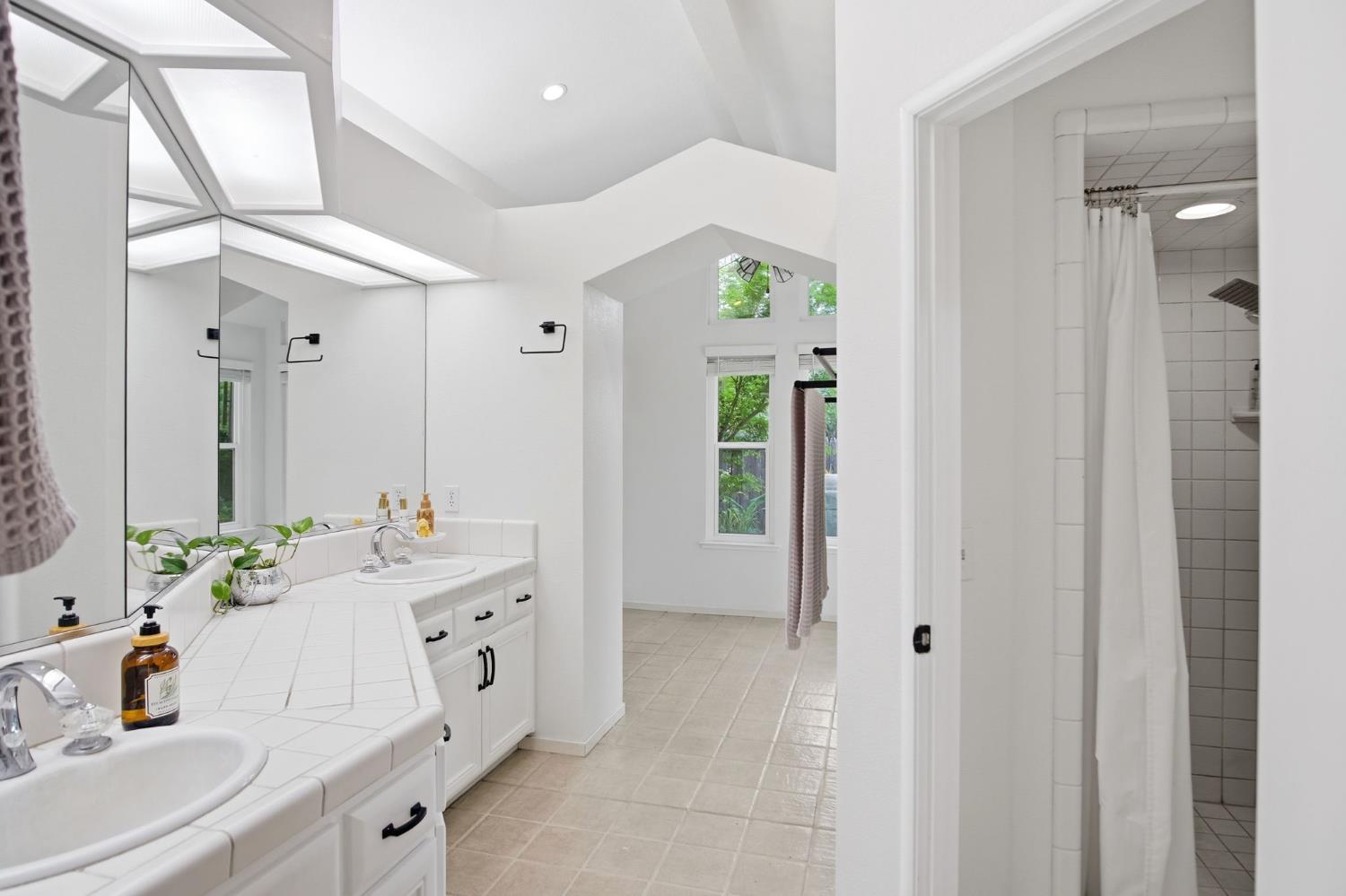 3501 North Avenue Modesto, CA 95358 - Photo 25 of 44 a bathroom with a sink double vanity and a mirror