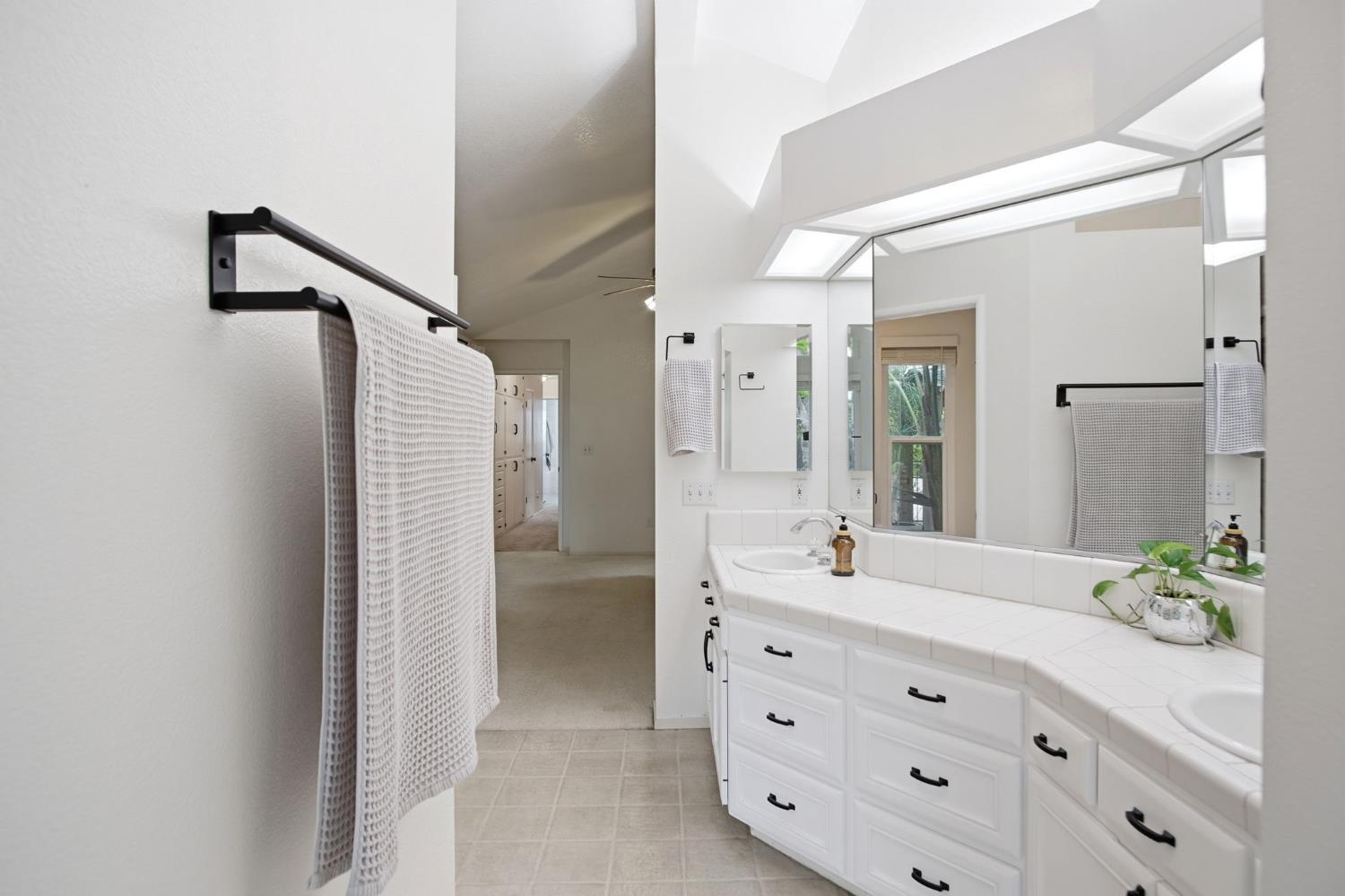 3501 North Avenue Modesto, CA 95358 - Photo 27 of 44 a bathroom with a double vanity sink mirror and shower