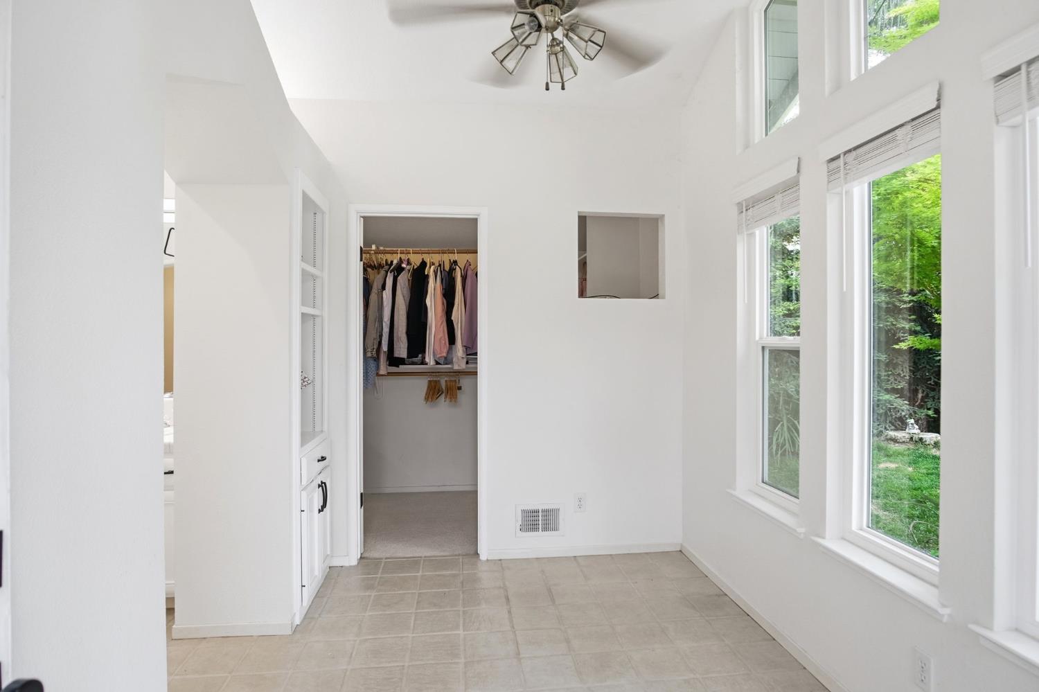 3501 North Avenue Modesto, CA 95358 - Photo 28 of 44 a view of a hallway with windows and chandelier