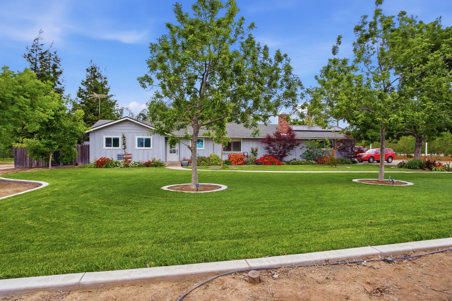 3501 North Avenue Modesto, CA 95358 - Photo 3 of 44 a front view of house with yard and green space