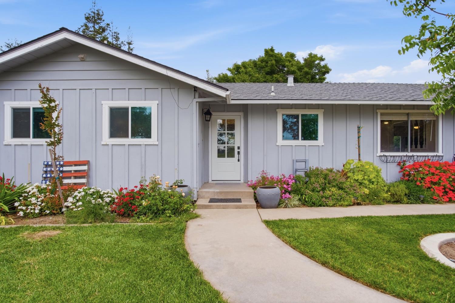 3501 North Avenue Modesto, CA 95358 - Photo 5 of 44 a front view of a house with a yard