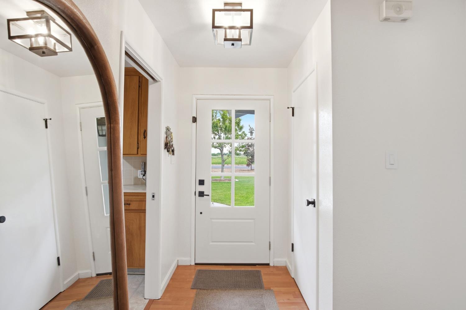 3501 North Avenue Modesto, CA 95358 - Photo 6 of 44 a view of hallway with wooden floor and window