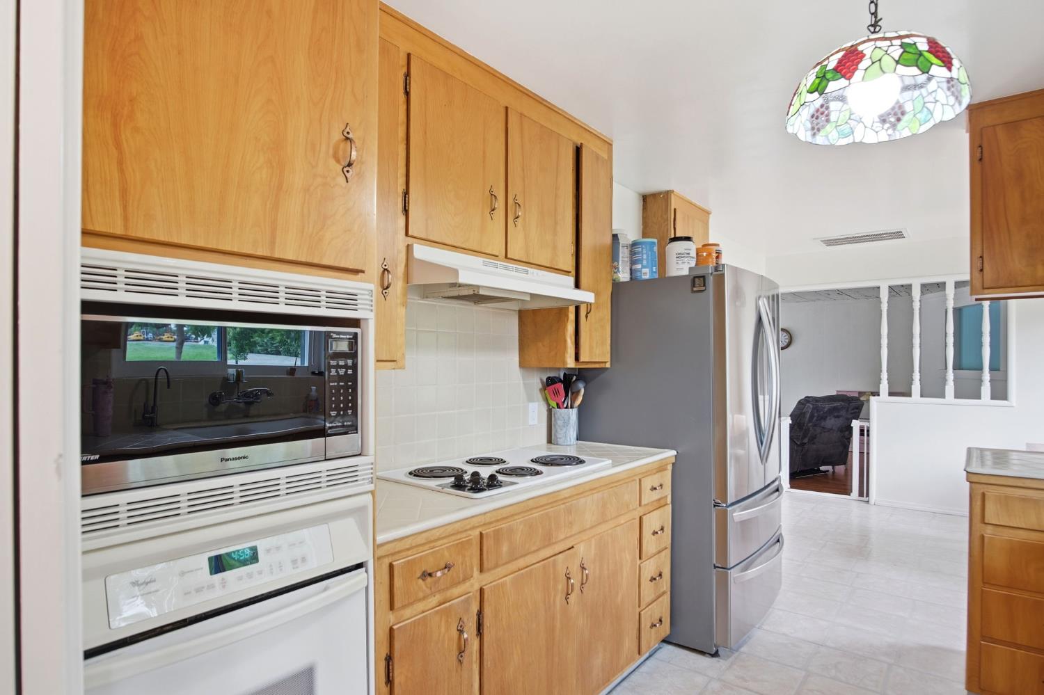 3501 North Avenue Modesto, CA 95358 - Photo 8 of 44 a kitchen with a stove and a microwave