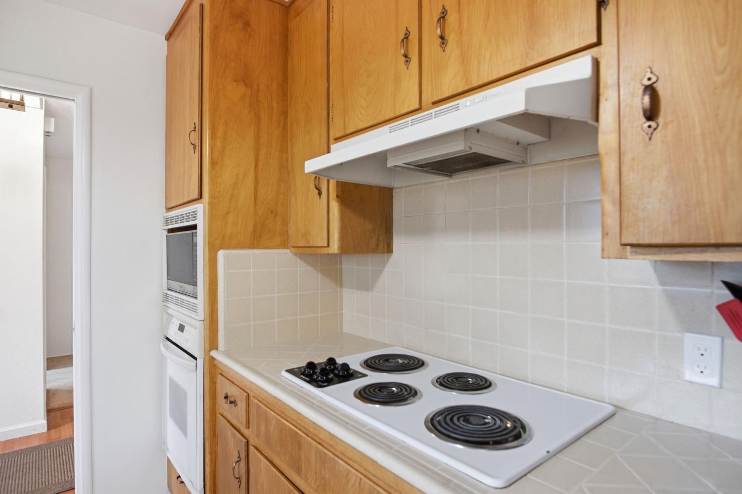 3501 North Avenue Modesto, CA 95358 - Photo 10 of 44 a white stove top oven sitting inside of a kitchen