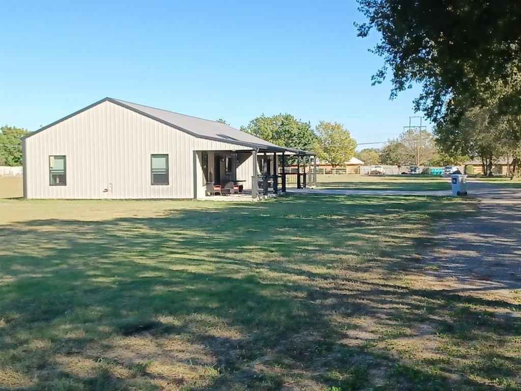 109 Cole Road Red Oak, TX 75154 - Photo 16 of 39 a backyard of a house with table and chairs