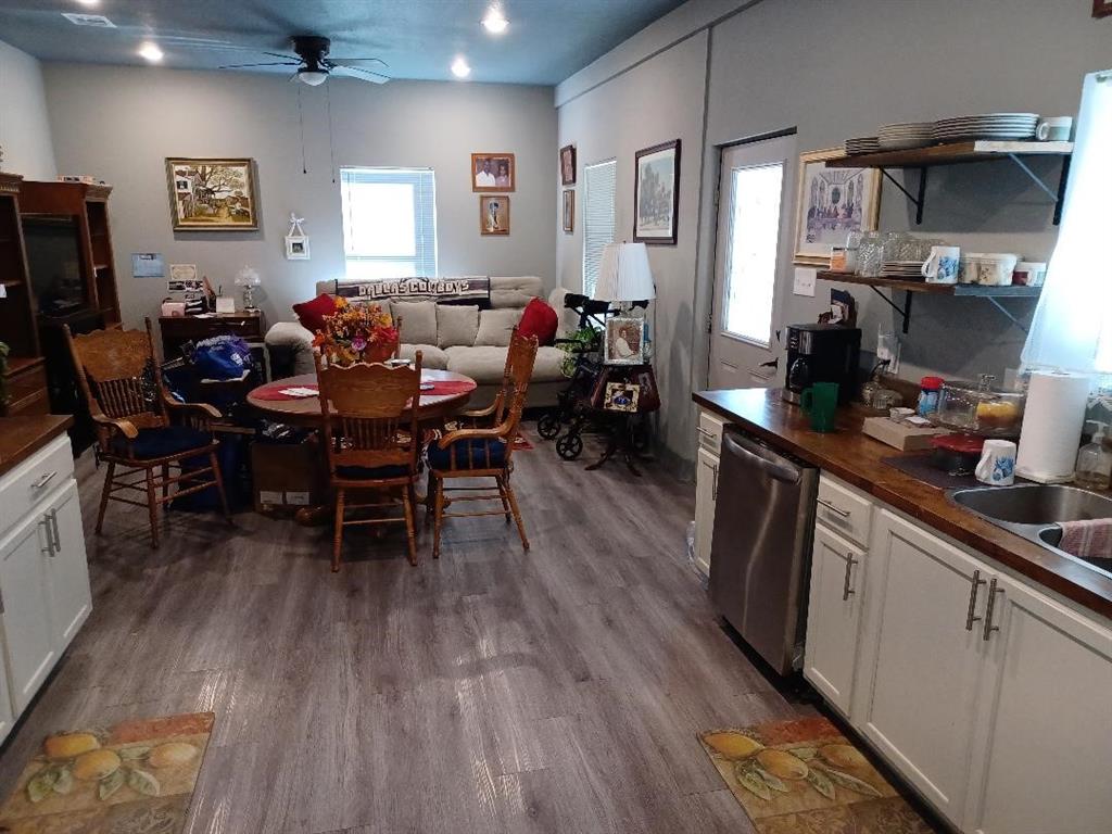 109 Cole Road Red Oak, TX 75154 - Photo 19 of 39 a view of a dining room with furniture window and wooden floor