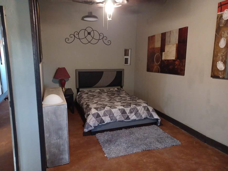 109 Cole Road Red Oak, TX 75154 - Photo 25 of 39 a bedroom with a bed and painting on the wall