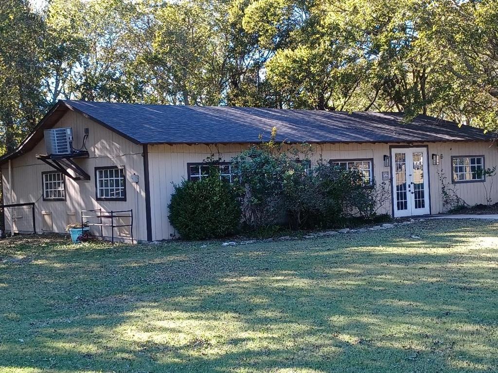 109 Cole Road Red Oak, TX 75154 - Photo 26 of 39 a view of a house with a big yard potted plants and large tree