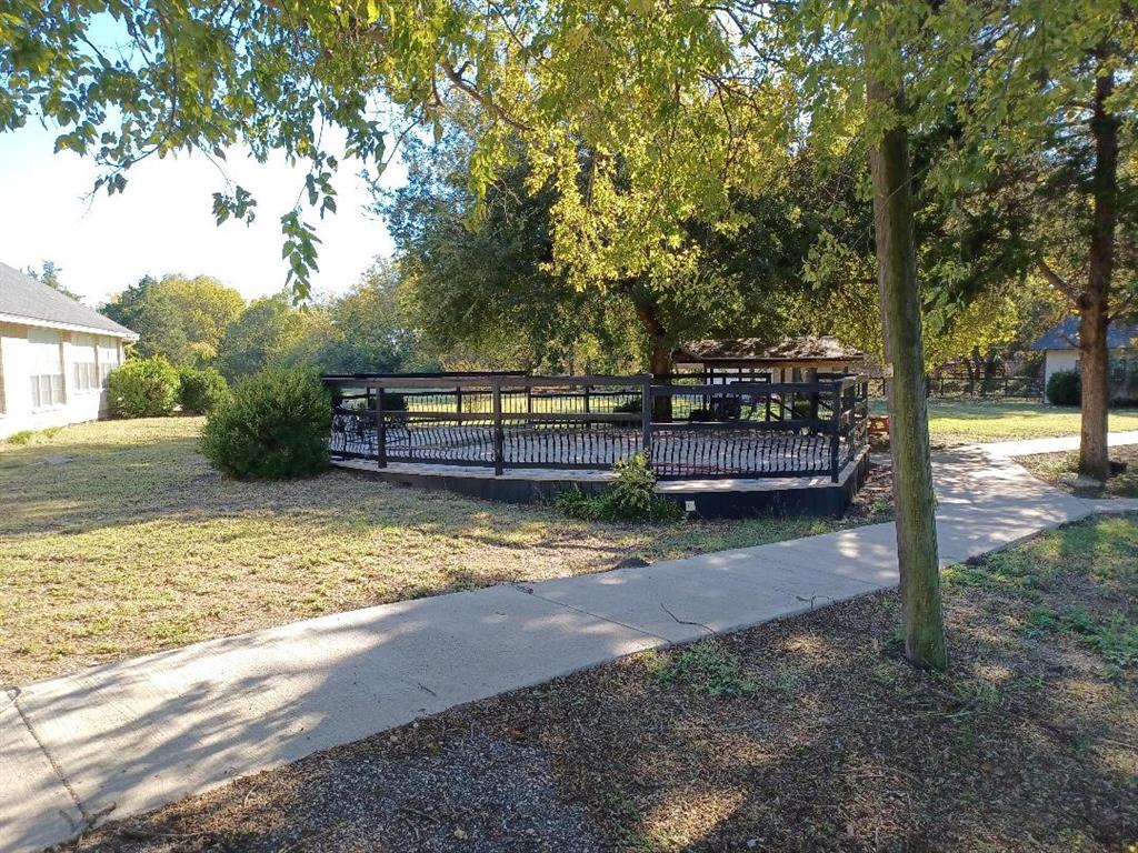 109 Cole Road Red Oak, TX 75154 - Photo 27 of 39 a view of backyard with trees