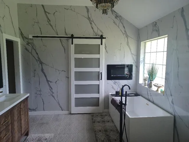 a view of a livingroom with furniture and windows