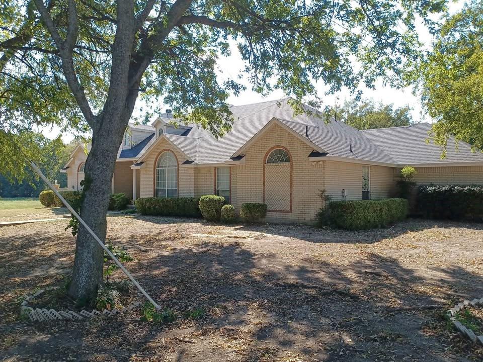109 Cole Road Red Oak, TX 75154 - Photo 10 of 39 a front view of a house with a yard and garage