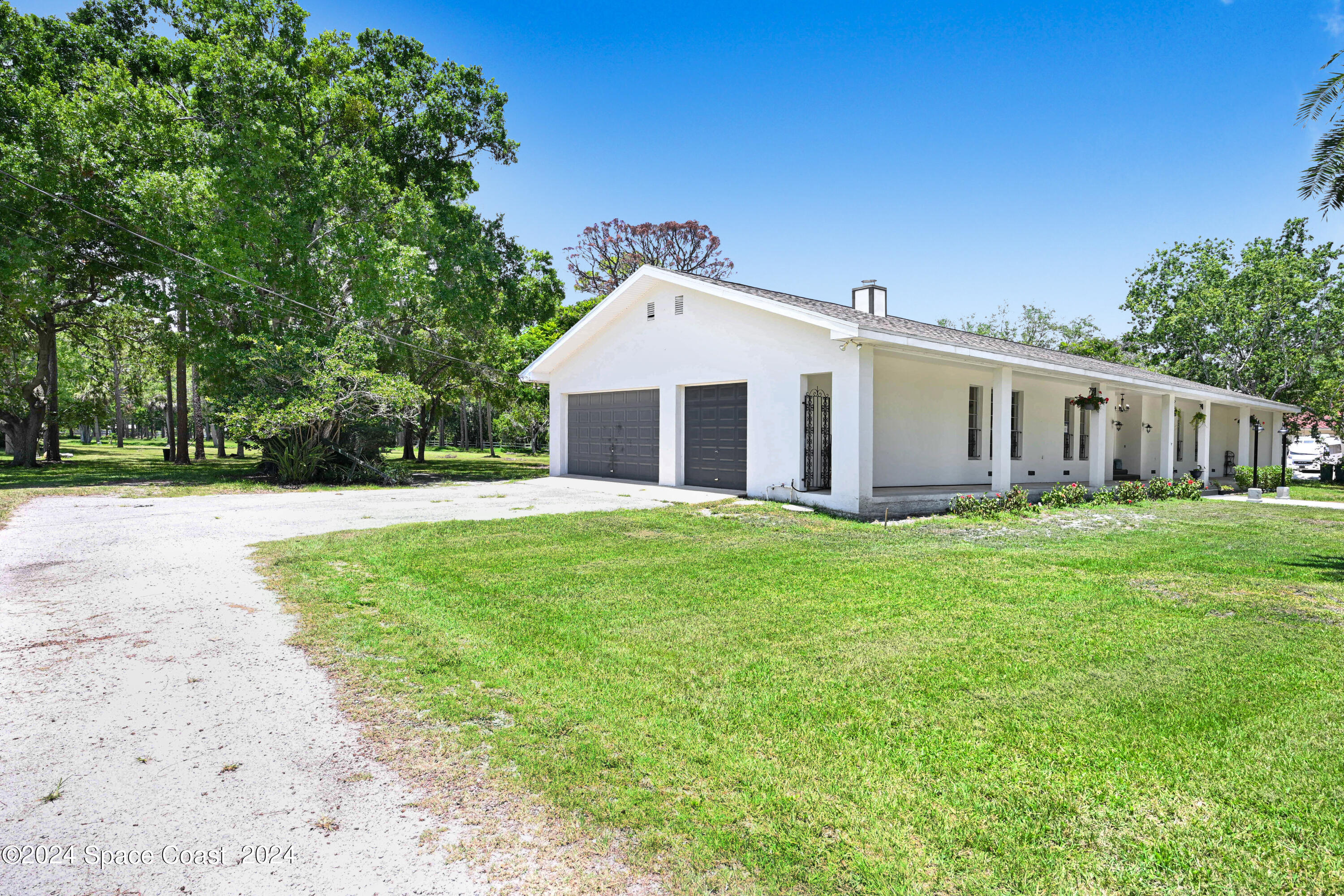 2340 Turtle Mound Road Melbourne, FL 32934 - Photo 20 of 28 a front view of house with yard and green space