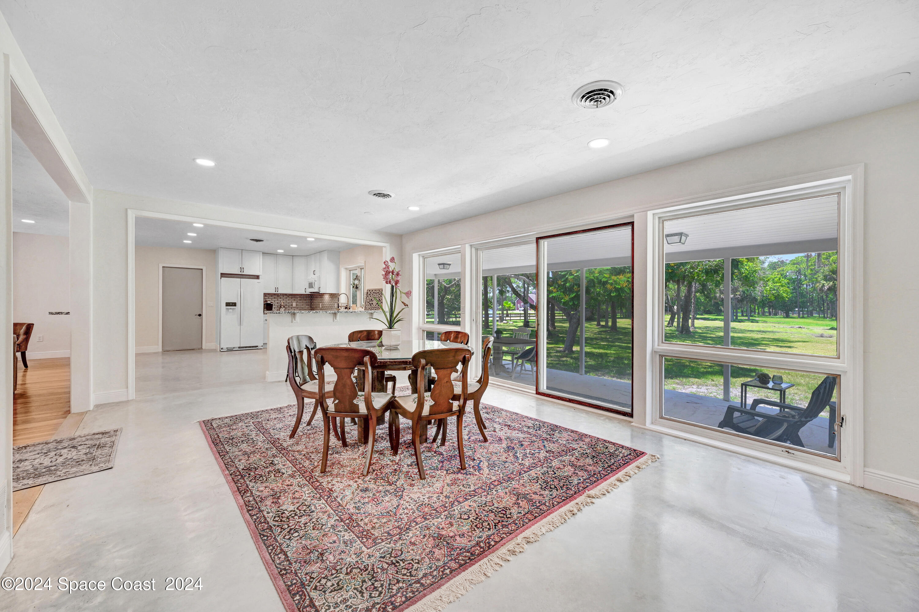 2340 Turtle Mound Road Melbourne, FL 32934 - Photo 4 of 28 a view of a dining room with furniture window and outside view