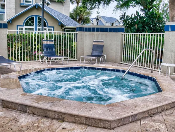 a view of a house with a yard and deck
