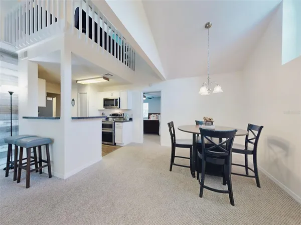 a view of a dining room with furniture