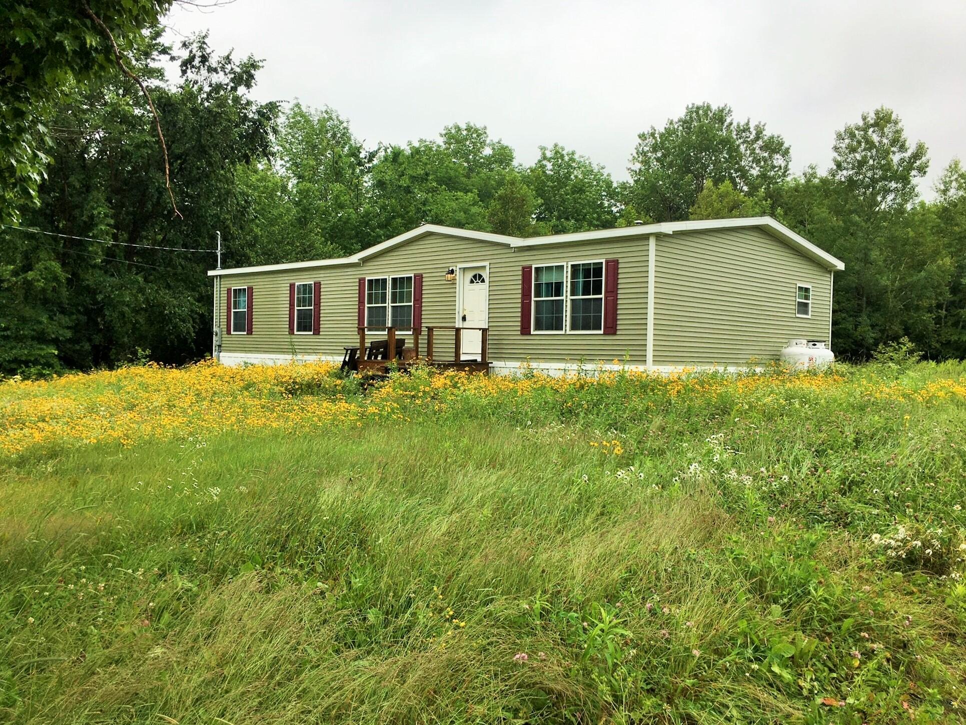 1005 Estabrook Road Amity, ME 04471 - Photo 1 of 34 New front 1