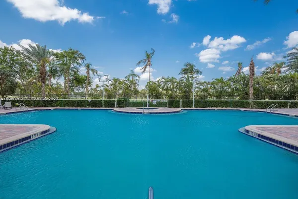 a view of a swimming pool with a lake view