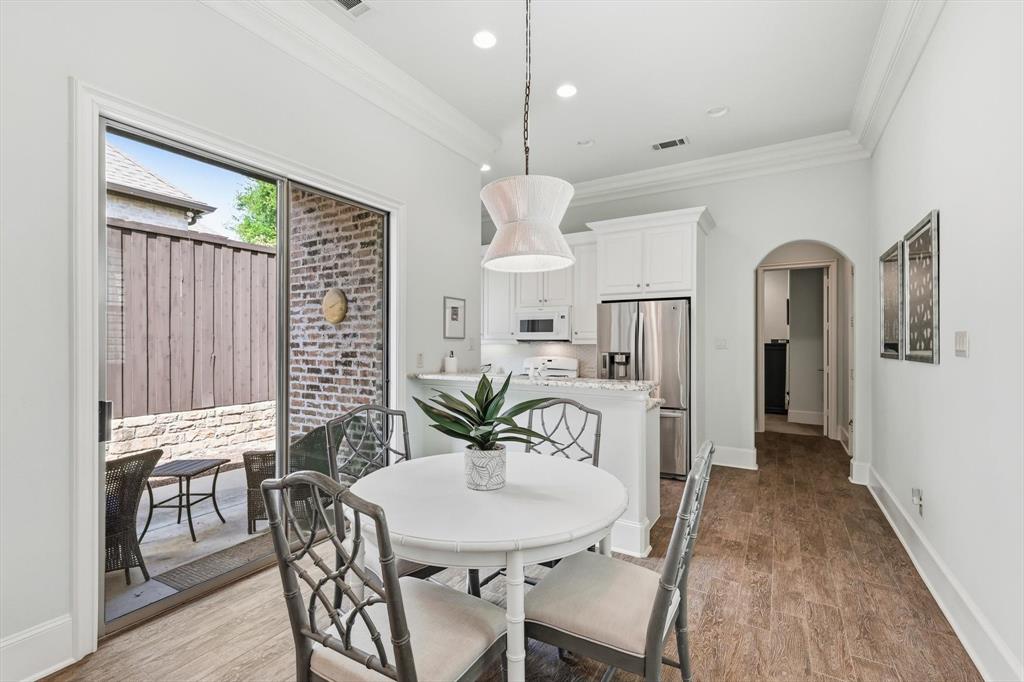 476 Hidden Valley Lane Coppell, TX 75019 - Photo 29 of 40 a view of a dining room with furniture window and wooden floor