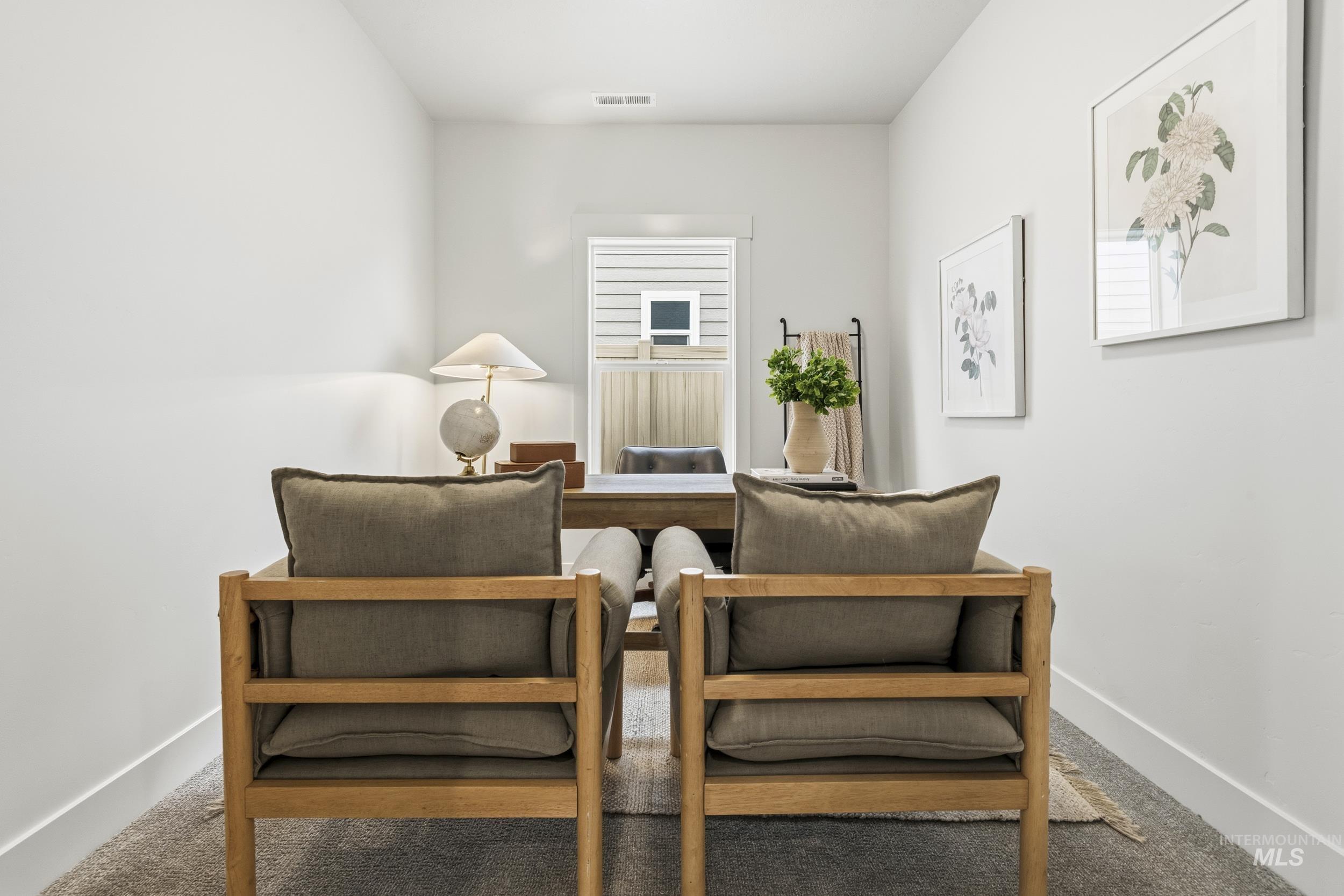 1988 West Bittern Street Nampa, ID 83686 - Photo 11 of 34 Living area featuring baseboards and carpet floors