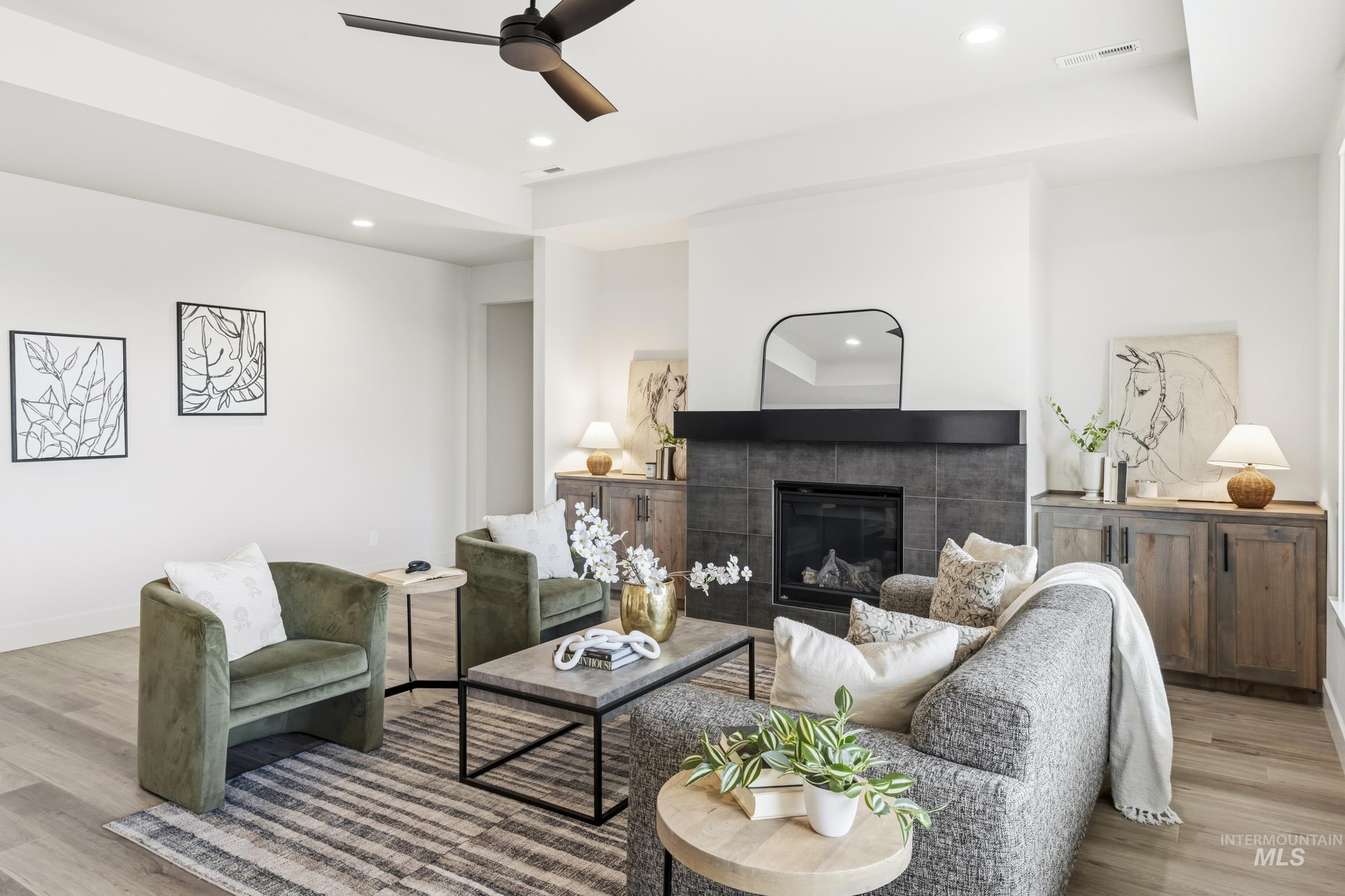 1988 West Bittern Street Nampa, ID 83686 - Photo 16 of 34 Living area with light wood-style floors, a fireplace, ceiling fan, and recessed lighting