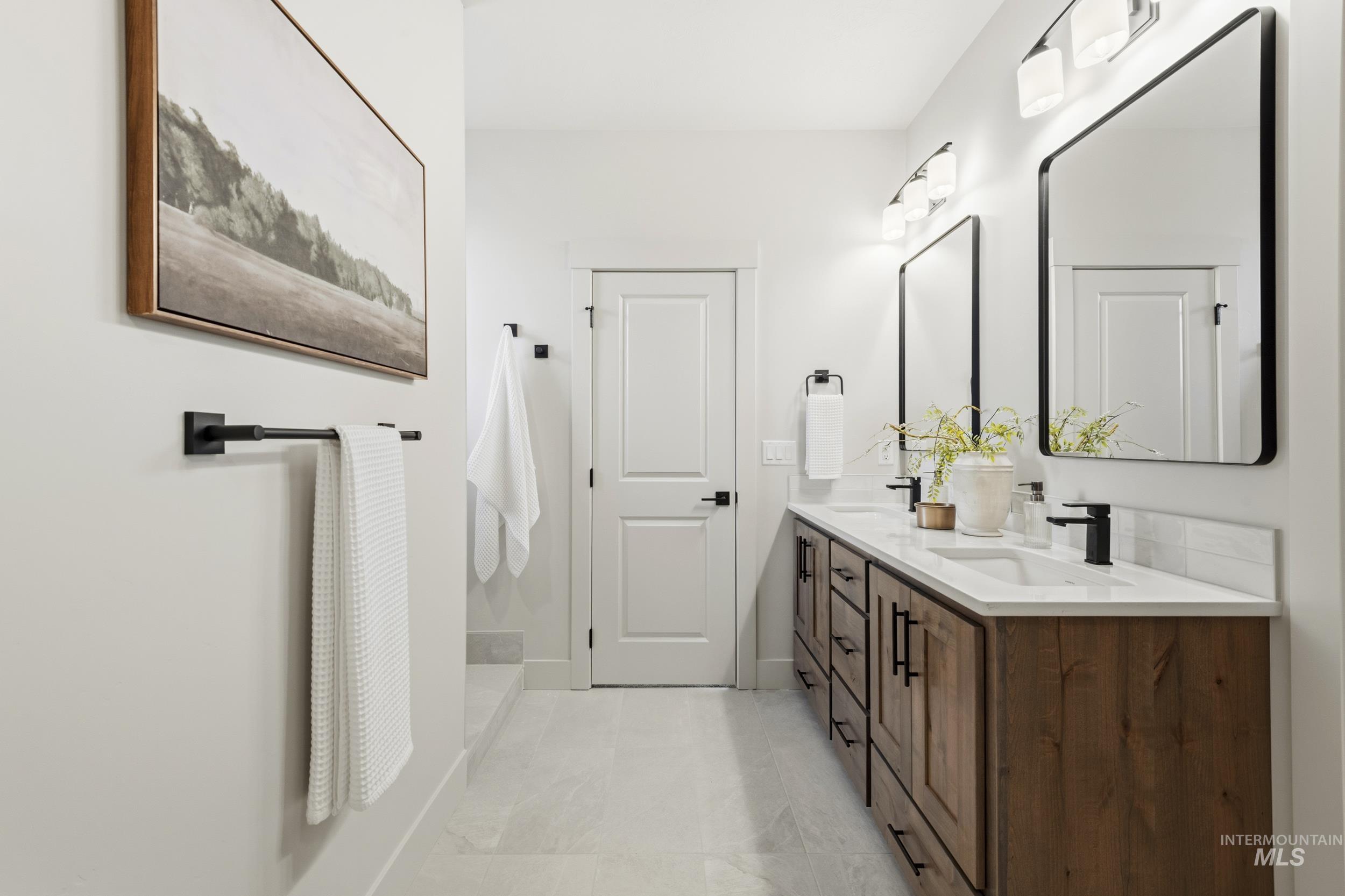 1988 West Bittern Street Nampa, ID 83686 - Photo 28 of 34 Full bathroom featuring double vanity and baseboards