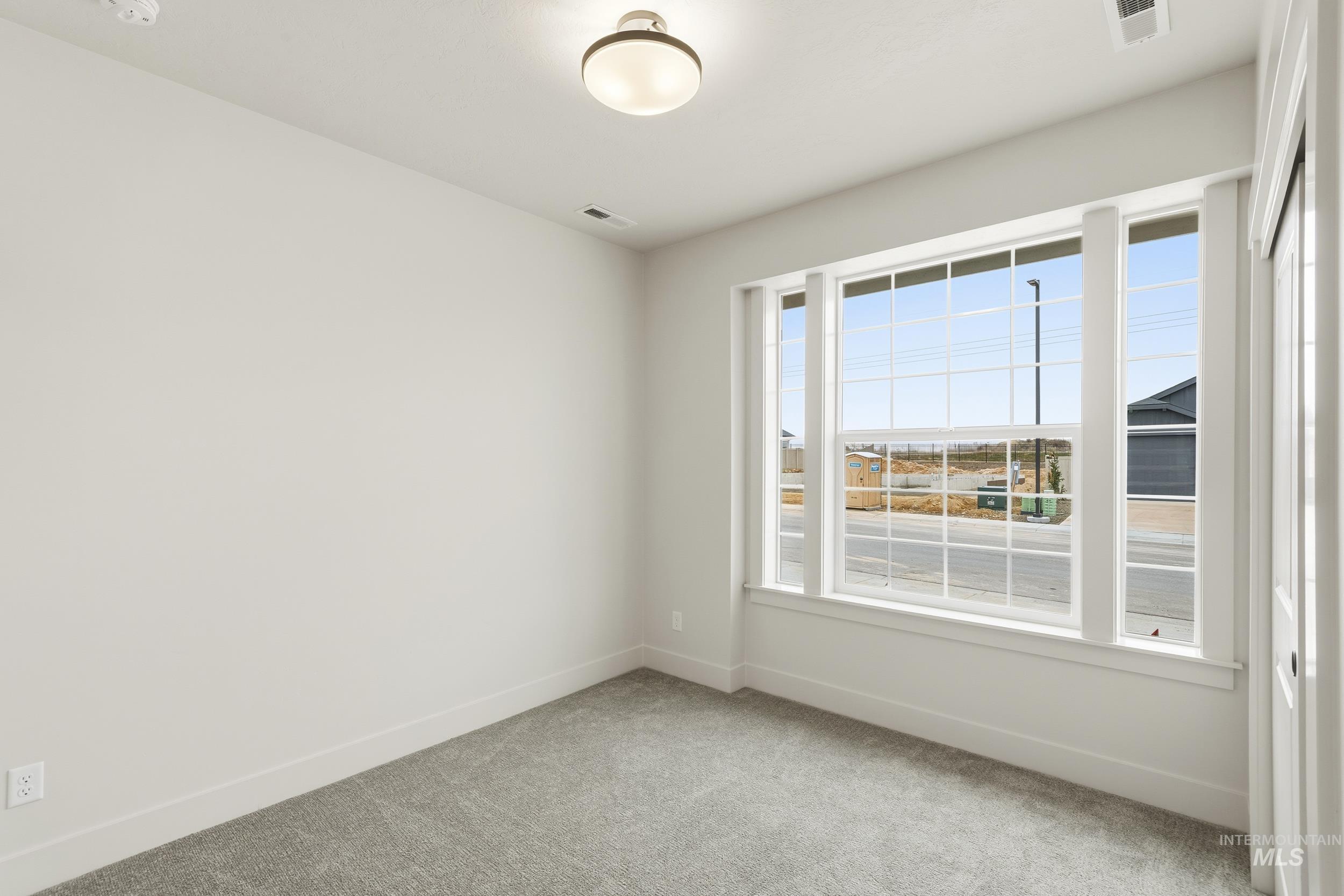 1988 West Bittern Street Nampa, ID 83686 - Photo 7 of 34 Unfurnished room with light carpet and baseboards
