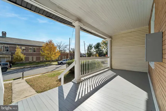 a view of a balcony with furniture