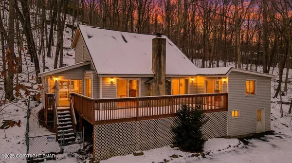 a view of a brick house with a large windows