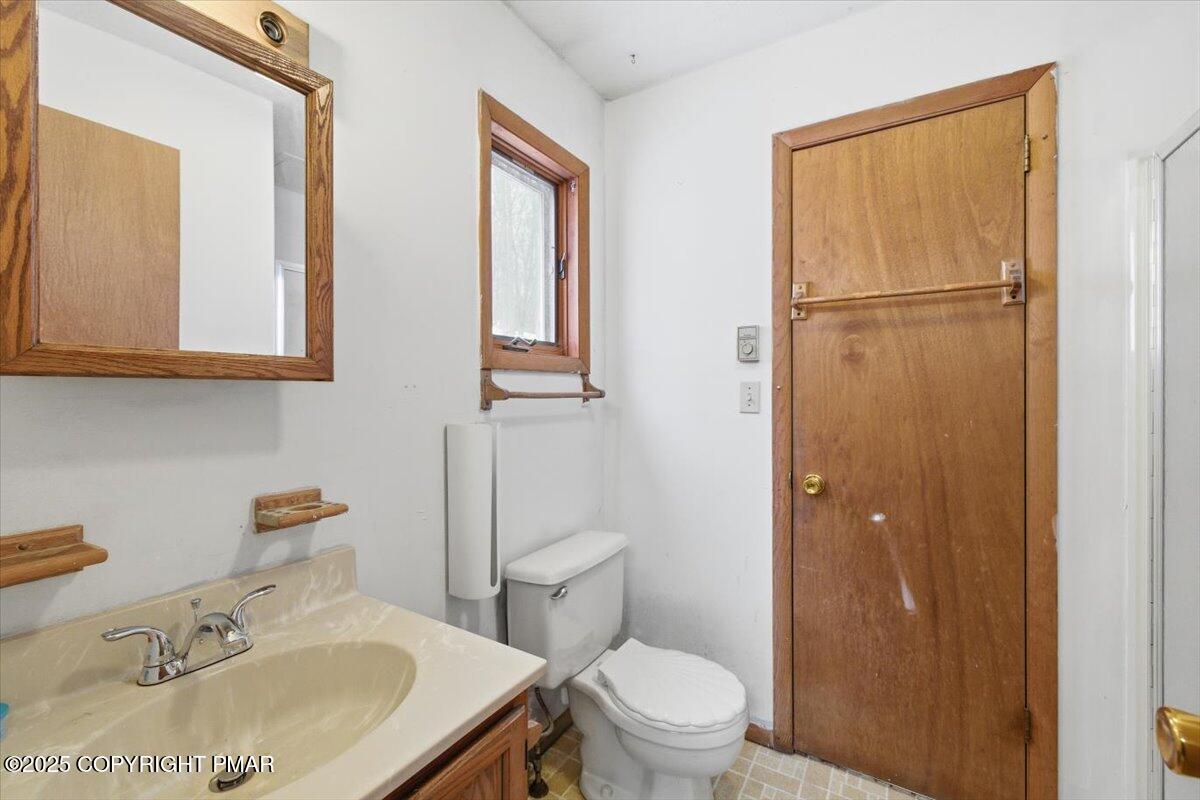 5695 Decker Road Bushkill, PA 18324 - Photo 13 of 29 a bathroom with a sink toilet and shower