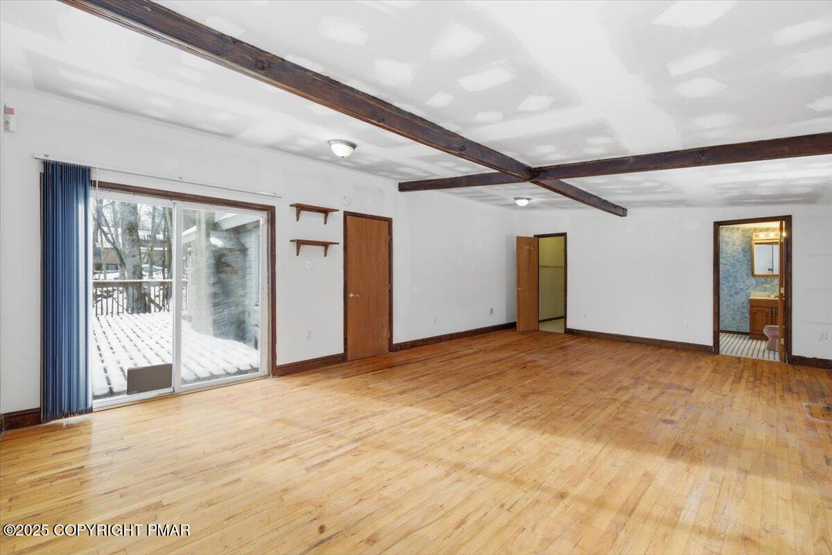 5695 Decker Road Bushkill, PA 18324 - Photo 15 of 29 a view of an empty room with wooden floor and a window