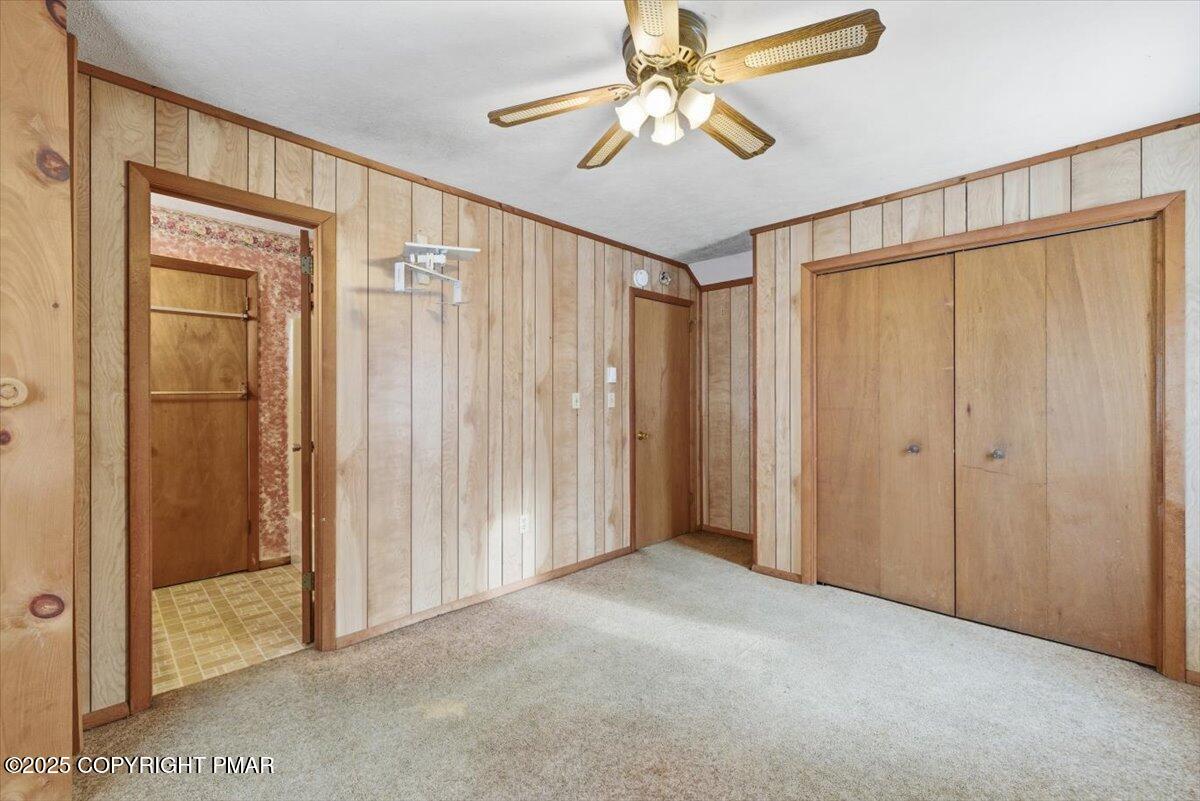 5695 Decker Road Bushkill, PA 18324 - Photo 24 of 29 a view of a hallway with a chandelier fan