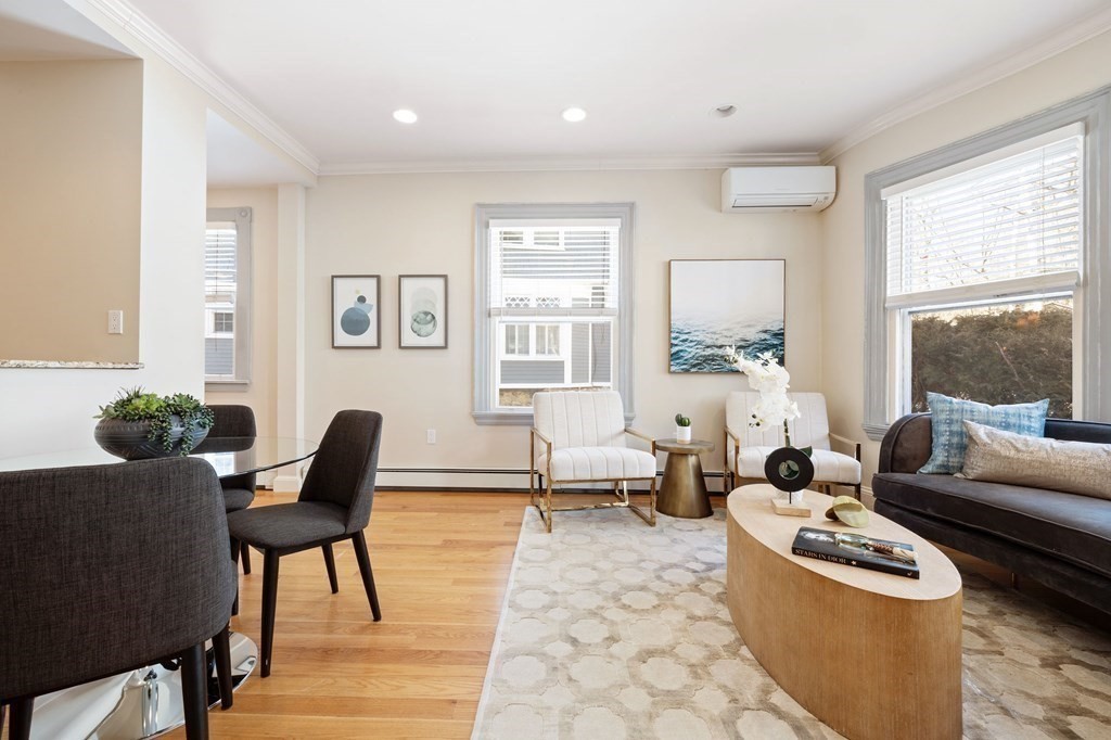 12 Colliston Road, Unit 2 Boston, MA 02135 - Photo 2 of 10 a living room with furniture and a large window
