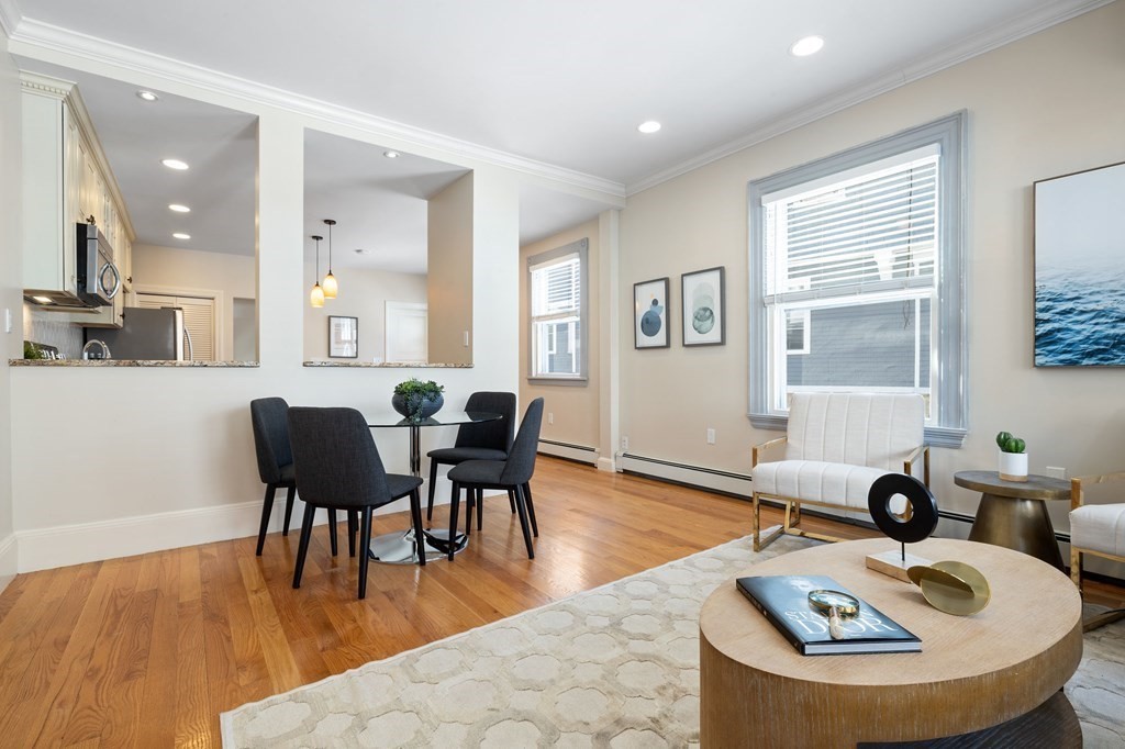 12 Colliston Road, Unit 2 Boston, MA 02135 - Photo 4 of 10 a living room with furniture and wooden floor
