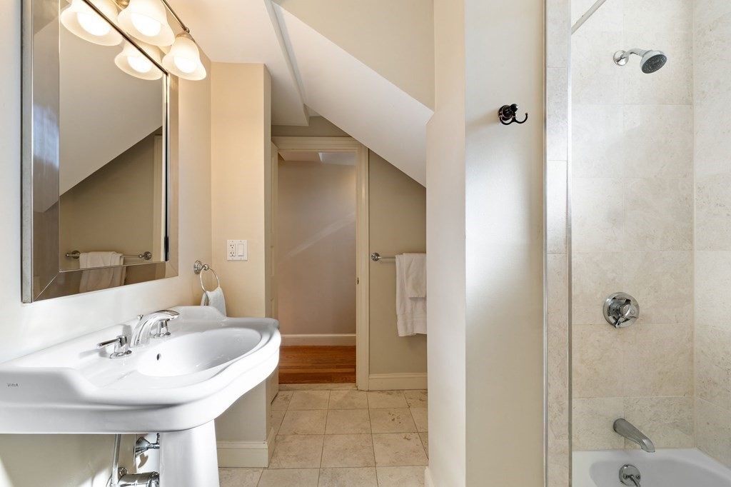 12 Colliston Road, Unit 2 Boston, MA 02135 - Photo 8 of 10 a bathroom with a sink and a mirror