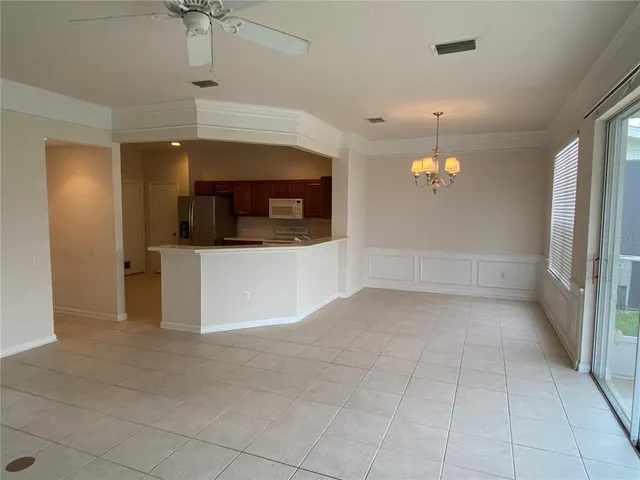 a view of a kitchen with a sink and a microwave