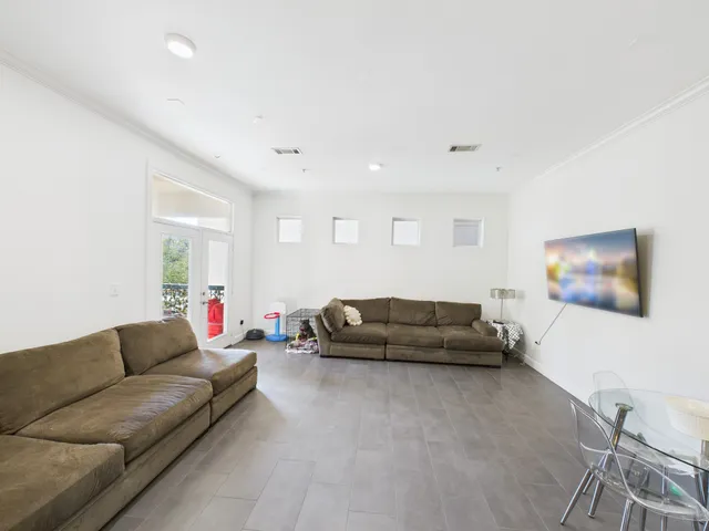 a bathroom with a granite countertop sink and a mirror with toilet