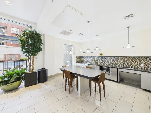 a view of kitchen with furniture and potted plant