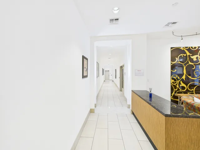 a view of a bathroom with sink and mirror