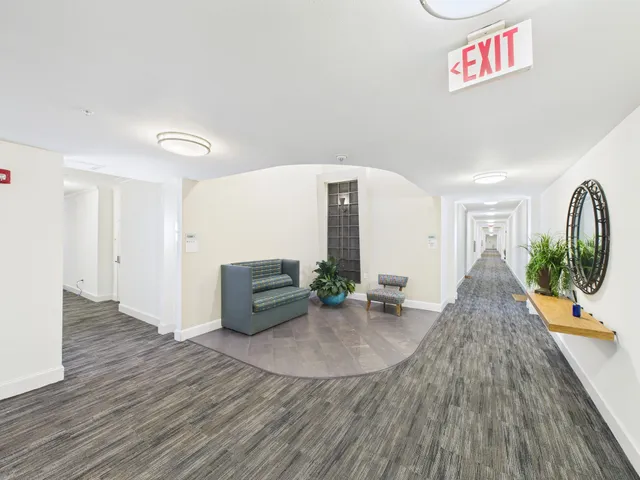 a view of a brick building from a balcony