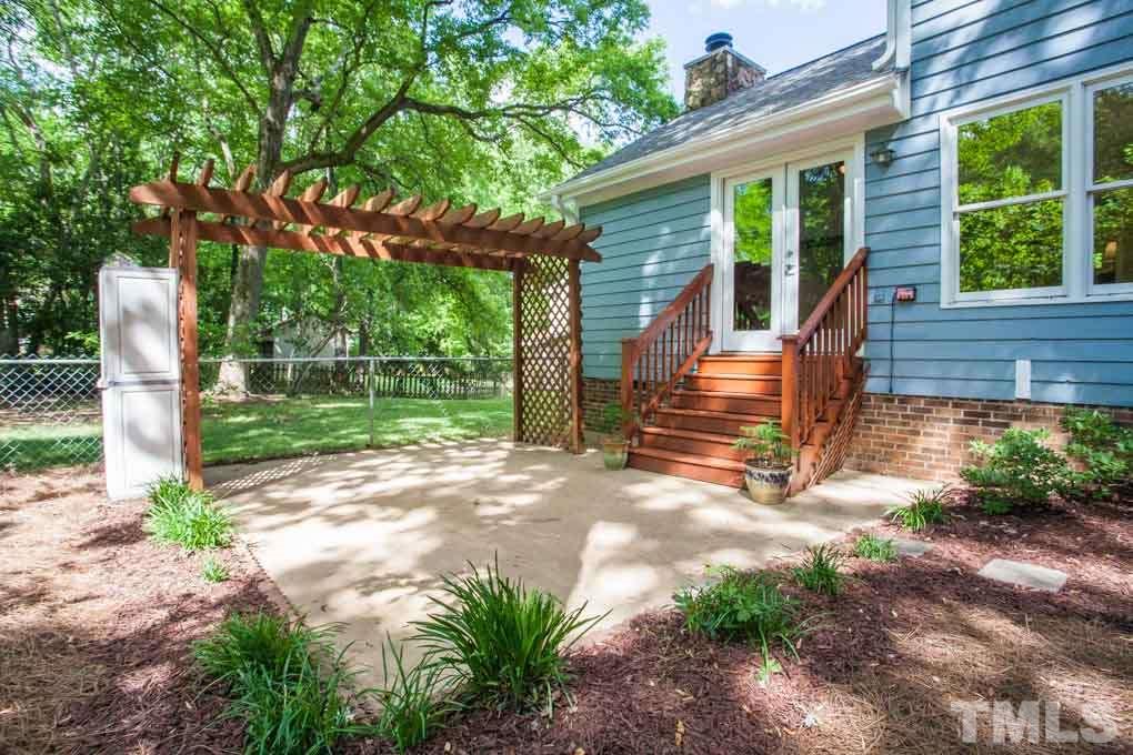6109 Valleyfield Circle Raleigh, NC 27612 - Photo 11 of 11 Partially FENCED backyard with PERGOLA and plenty of space to entertain