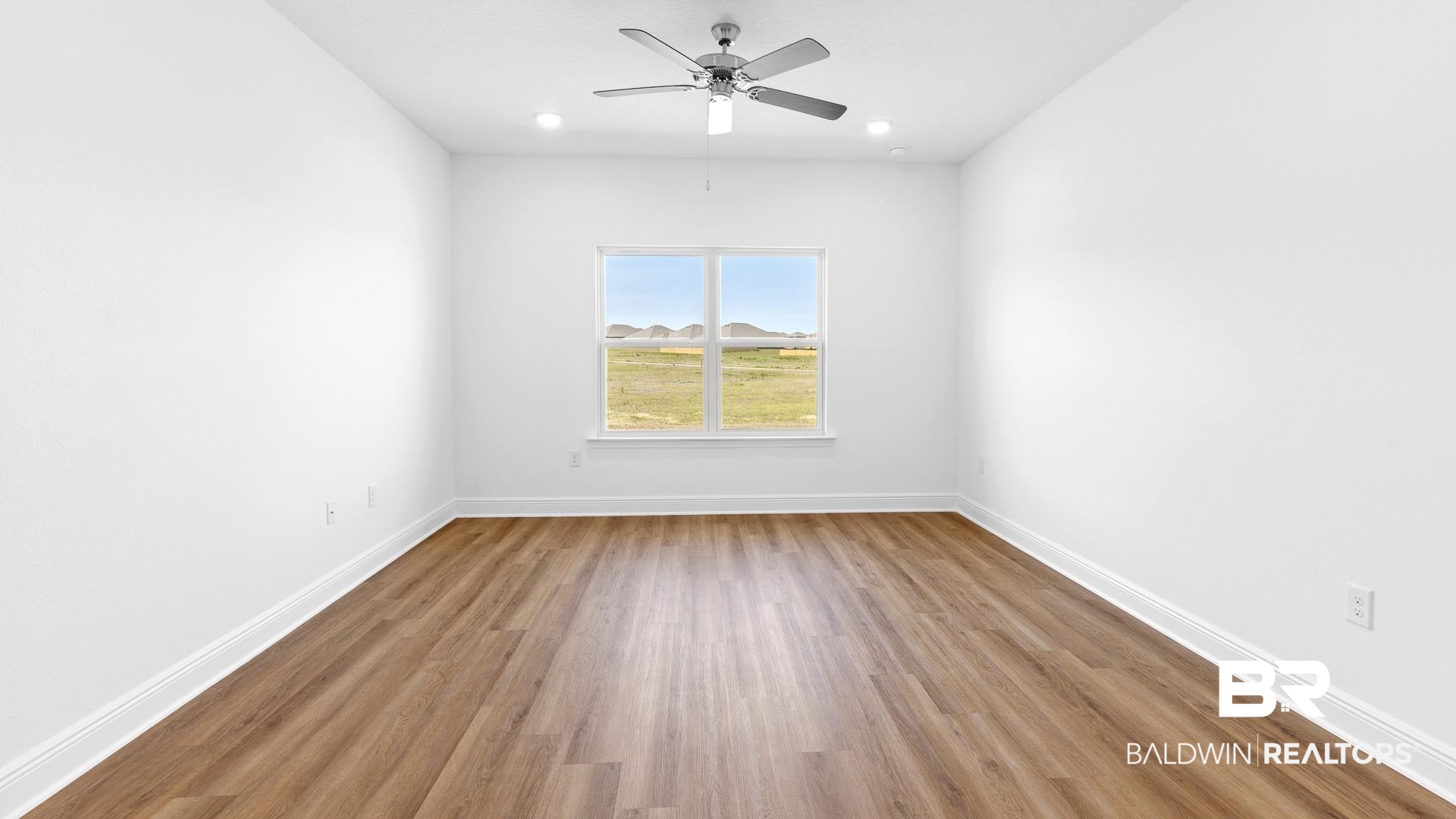 12931 Grand Rpds Road Fairhope, AL 36532 - Photo 23 of 33 Empty room featuring recessed lighting, baseboards, wood finished floors, and a ceiling fan