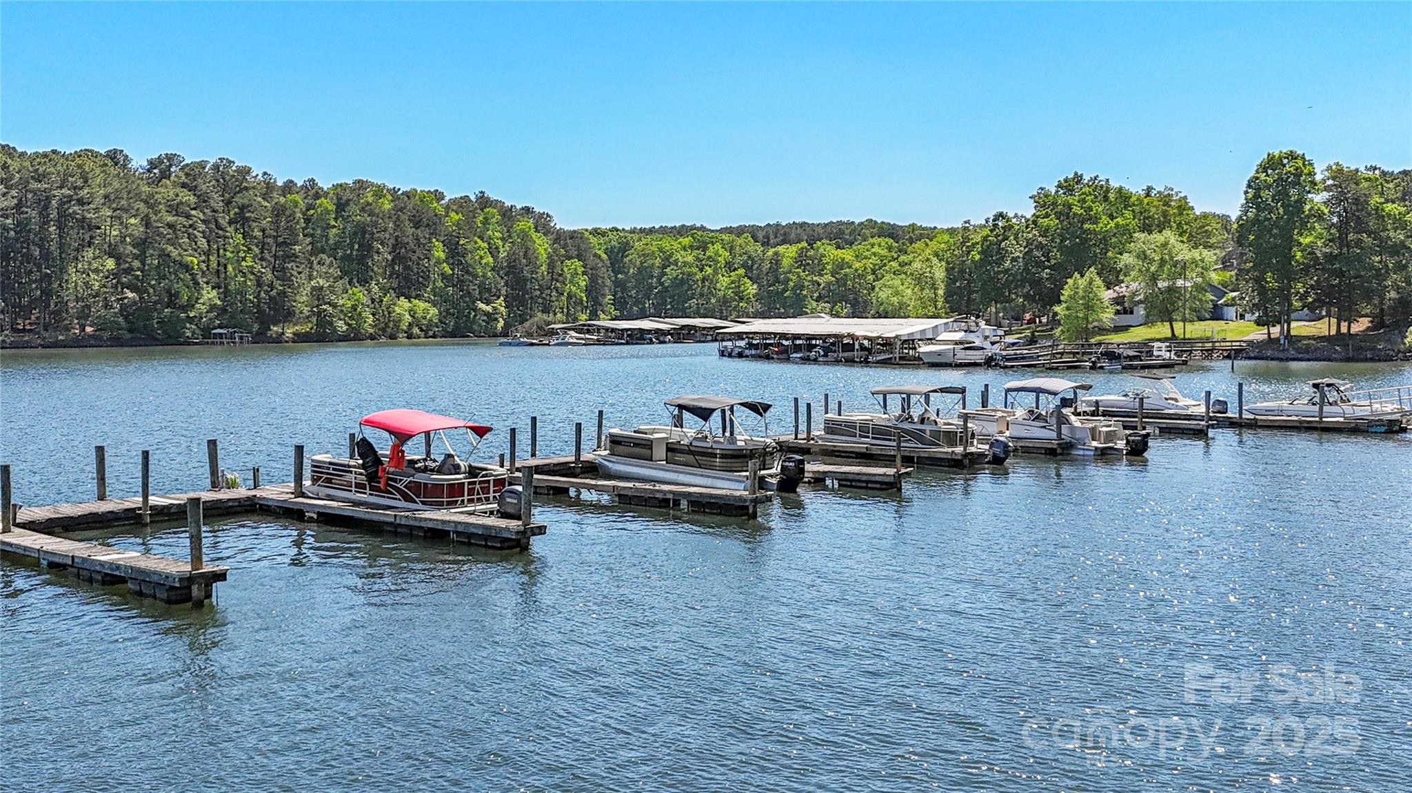 1088 Arundle Road Sherrills Ford, NC 28673 - Photo 28 of 31 a view of a lake with boats and trees in the background